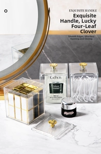 Detailed view of clear acrylic storage box with gold clover handle and vertical stripes