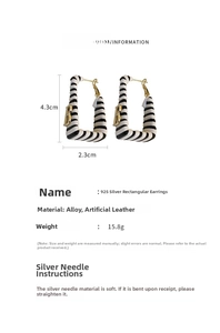 Detail showing faux leather earrings with B logo and 925 silver needle size specs