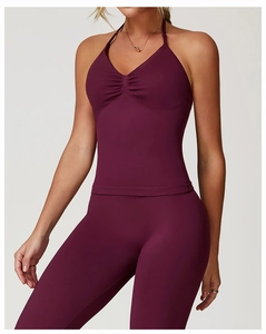 Detail of burgundy seamless halter yoga tank top with ruched neckline for workout