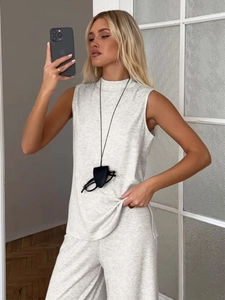 Detail of light gray sleeveless vest and elastic wide leg trousers loungewear set