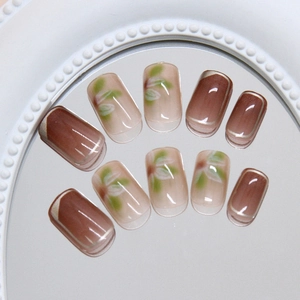 Elegant gold brown floral press-on nails set with handmade gradient and leaf patterns
