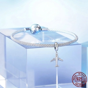 925 sterling silver mesh bracelet featuring a miniature airplane charm on a blue block