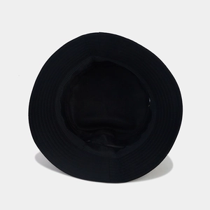 Internal structure of a black cotton bucket hat showing stitching and lining details