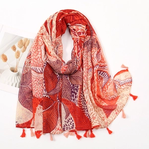 Bohemian style linen scarf with paisley prints and delicate tassels on a white background