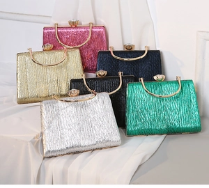 Pleated evening clutch bags in six metallic colors with gold handles and crystal clasps