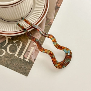 Detail of tortoise shell acetate wave hair pin with single crystal and France Handmade stamp