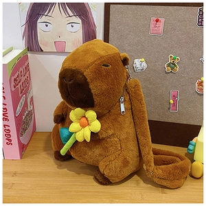 Detail of plush Capybara shoulder bag showing brown fur texture and yellow flower decor