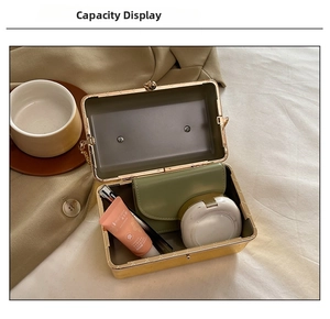 Interior view of acrylic evening clutch bag showing capacity for wallet and cosmetics