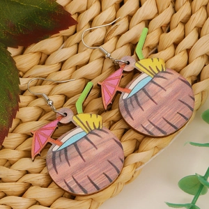 Creative coconut drink wooden earrings with pink umbrella on a tropical woven mat