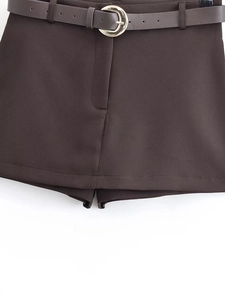 Detail view of coffee brown skort with matching belt and golden semicircular buckle