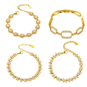 Set of four gold stainless steel bracelets with 5A cubic zirconia floral designs