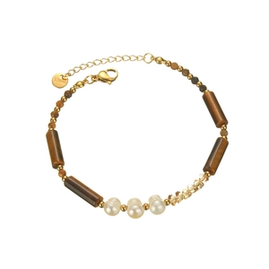 Golden stainless steel bracelet featuring tiger eye beads and natural pearls on white backdrop