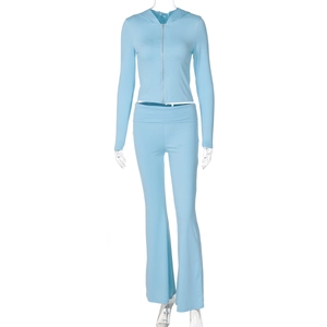 Detail of light blue ribbed fabric on zip-up hoodie and flared trousers tracksuit set