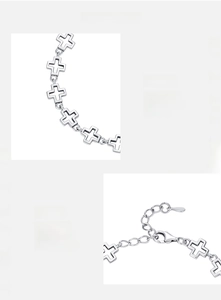 Detailed macro view of 925 sterling silver hollow cross bracelet with lobster clasp closure