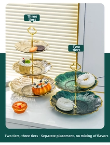 Macro shot of 2 and 3 tier glass tiered serving platters with gold metal handle and frames