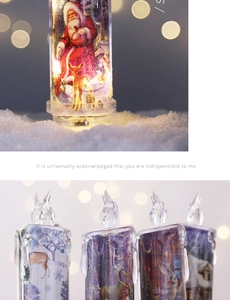 Detail of transparent Christmas LED candles with Santa and reindeer motifs on faux snow