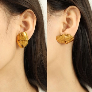 Elegant gold titanium steel earrings with a twisted shell texture for women