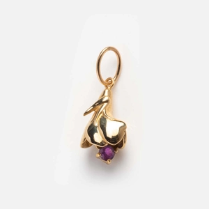 Detailed close-up of golden floral pendant featuring a round purple birthstone center