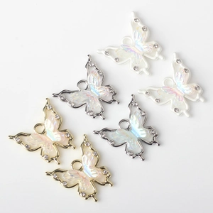 Sparkly butterfly charms for DIY jewelry making with colorful resin and rhinestones