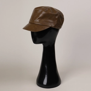 Detailed view of a brown faux leather cadet hat on a mannequin, showing PU texture