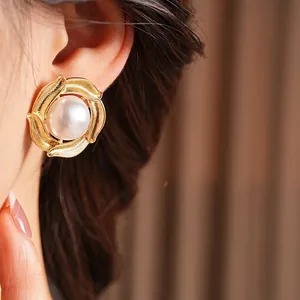 Retro style large pearl stud earrings with brushed gold spiral edges for women