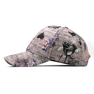 Detailed view of hip hop baseball cap with floral rose patterns and vintage lettering