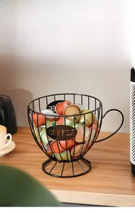 Macro view of matte black iron wire coffee capsule holder with a metal coffee logo tag