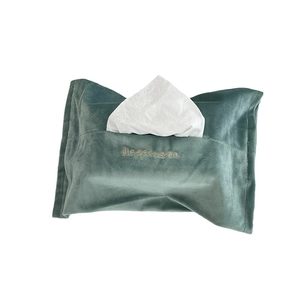 Dark green velvet tissue box cover with yellow Happiness embroidery on a white background