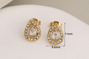Detail view of gold teardrop stud earrings with dimensions 11mm by 8.6mm shown in macro