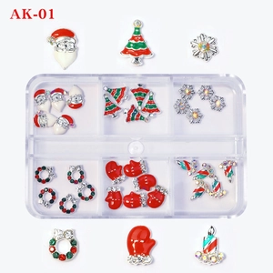 Macro view of Christmas nail art charms set with Santa, trees and snowflakes in a box