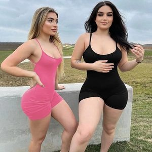 Detail of pink and black tight backless jumpsuits with pleated texture on models