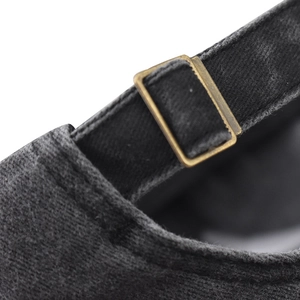 Detail of washed cotton baseball cap with adjustable antique bronze metal buckle