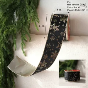 Detail view of 11x6cm Merry Christmas velvet ribbon with golden snowflakes on black fabric