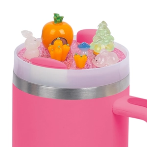 Detail view of 40oz pink tumbler lid with resin pumpkin house and rabbit miniatures