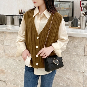 Brown knitted V-neck vest with vertical stripes and white buttons for women