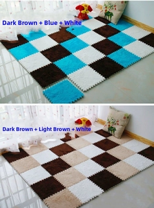 Detail of interlocking plush foam floor mats in coffee blue and white color combinations
