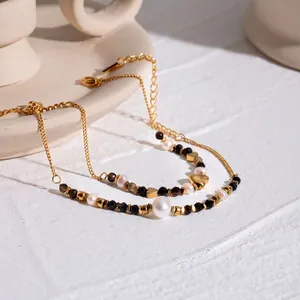 18k gold plated stainless steel bracelet with pearls, black stones and heart pendant