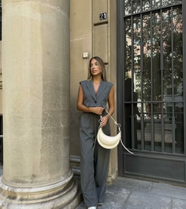 Fashionable grey pinstripe two-piece set with sleeveless vest and wide-leg trousers detail