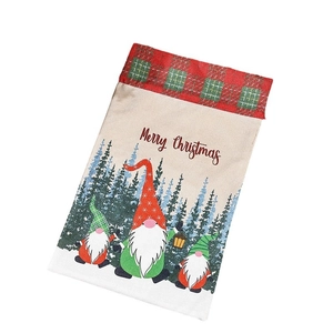Linen Christmas drawstring gift bag featuring cute gnome print and festive red plaid trim
