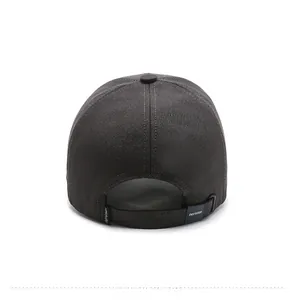 Close-up of adjustable back strap with brand logo on a dark grey structured baseball cap
