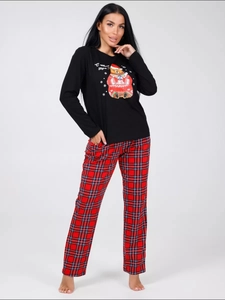 Close-up of cute Christmas bear print and festive Russian text on black pajama top
