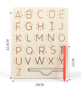 Detail view of wooden alphabet tracing board showing dimensions and letter stroke order