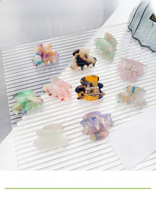 Detailed collection of nine colorful acetic acid hair claws with marble and tortoise patterns