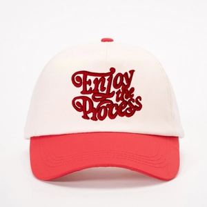Red and off-white baseball cap with Enjoy the Process embroidery in street style