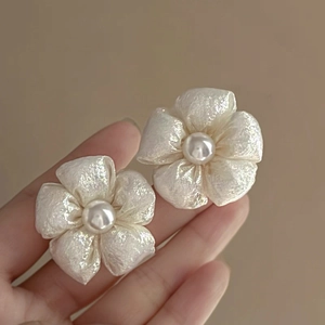 Elegant silver needle flower earrings with pearls and shimmering fabric petals