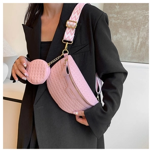 Pink woven belt bag with matching round coin purse on adjustable striped strap