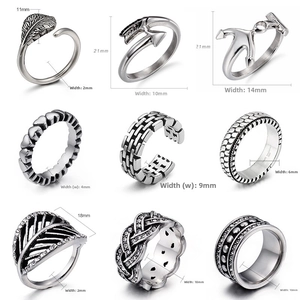Detailed collection of nine vintage silver rings with diverse retro engraved patterns