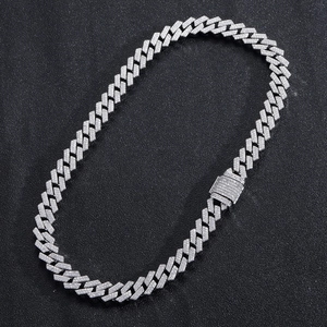 Detailed close-up of a silver Cuban link necklace with iced-out pave rhinestones