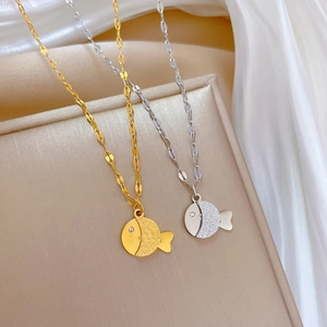 Minimalist matte fish pendant necklaces in gold and silver steel with sparkling crystals