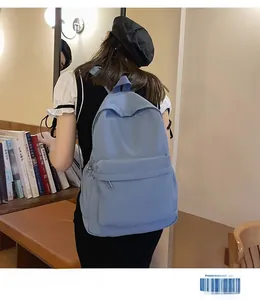 Blue minimalist backpack for students with large capacity and front zipper pocket